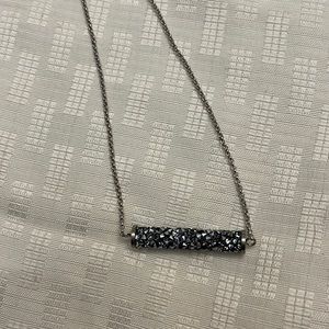 Touchstone crystal necklace with gray sparkly long barrel bead.
